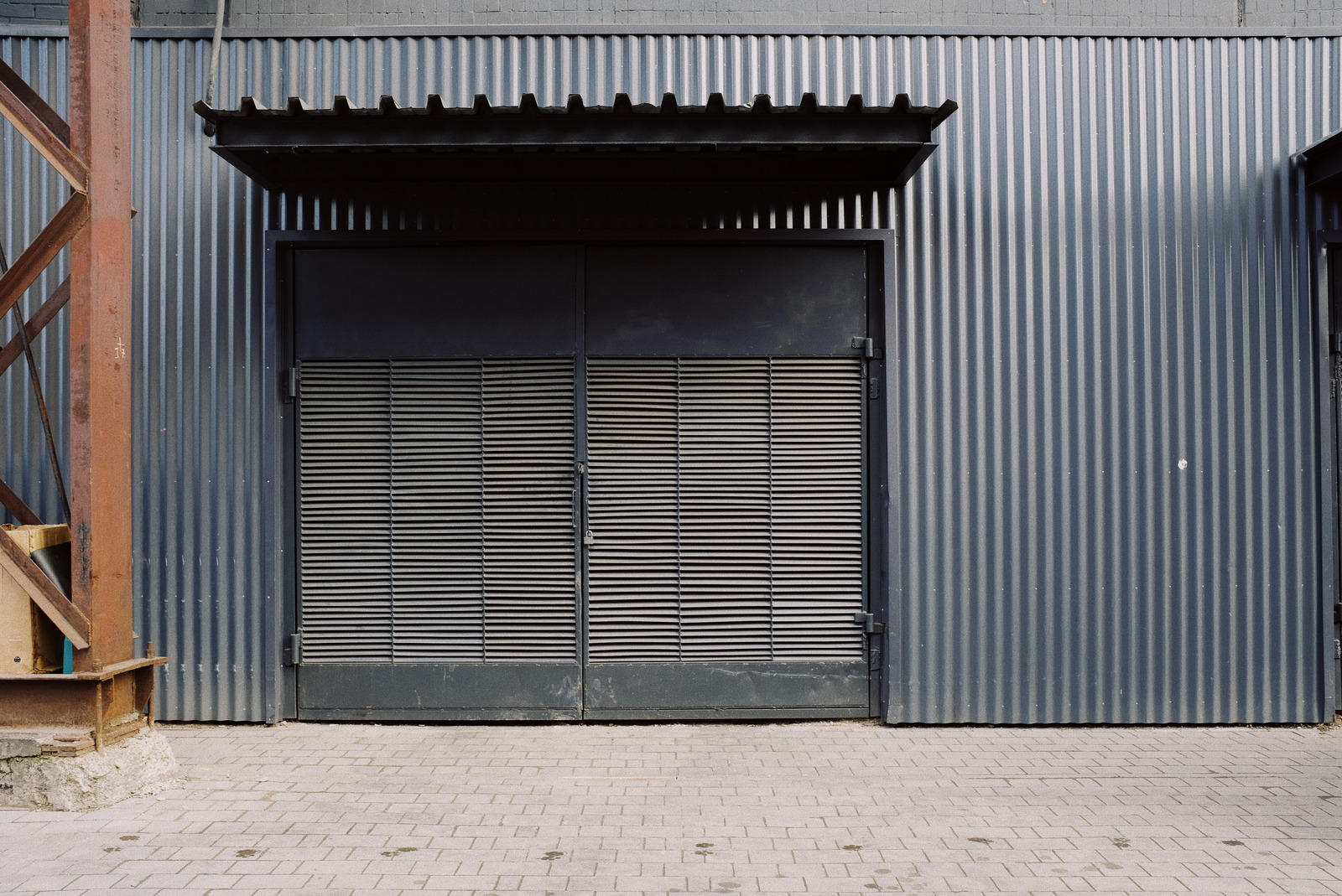 canva gray steel door MAD4PuZRTVo - Why Steel Buildings Are Still The Popular Choice In The USA